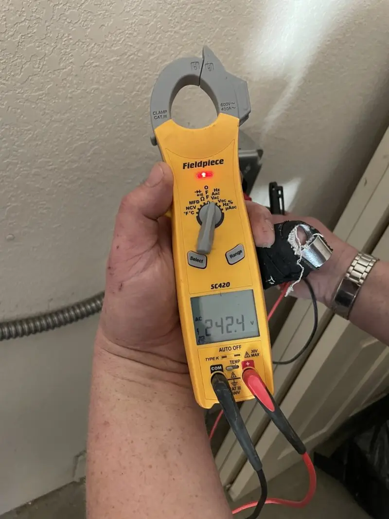 Voltage testing with clamp meter during Outlet Installation in Taylorville